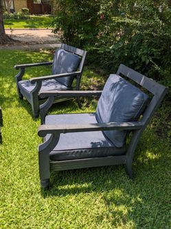 Two chairs with cushions..