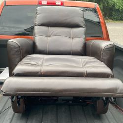 Brown leather recliner with orange stitches