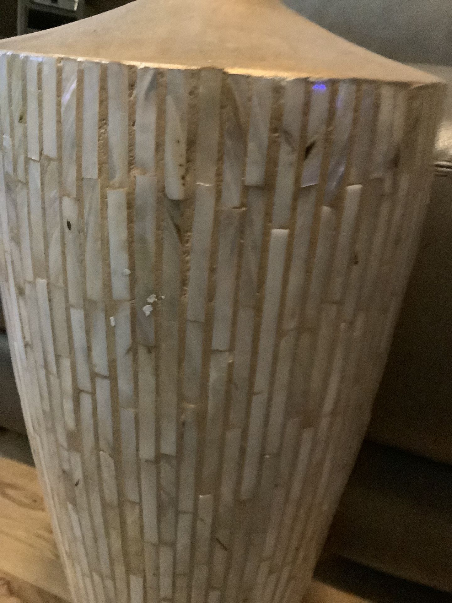 BEAUTIFUL 22” VASE WITH BLACK REEDS IN IT. IT IS BEAUTIFUL WHITE SHELL LIKE WITH GOLD.