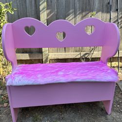 Restored pink fur bench with under storage and heart cutouts