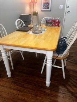 wooden table and 6 chairs