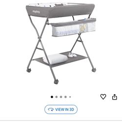 Brand new in box baby changing table with wheels 