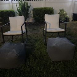 comfy outdoor seating. 2 rocking chairs and 2 Bean bag foot rests