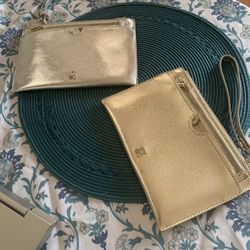 Two NY & CO Clutch Wristlets In Gold And Silver  