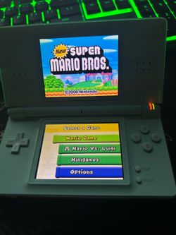 DS Lite Ice Blue variant with a R4 Cartridge