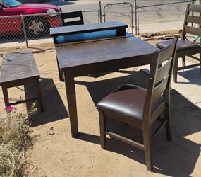 Tables and 3 chairs and a bench