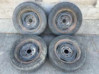 Disk brake 14x6 inch steelies with old tires. chevy impala Buick olds