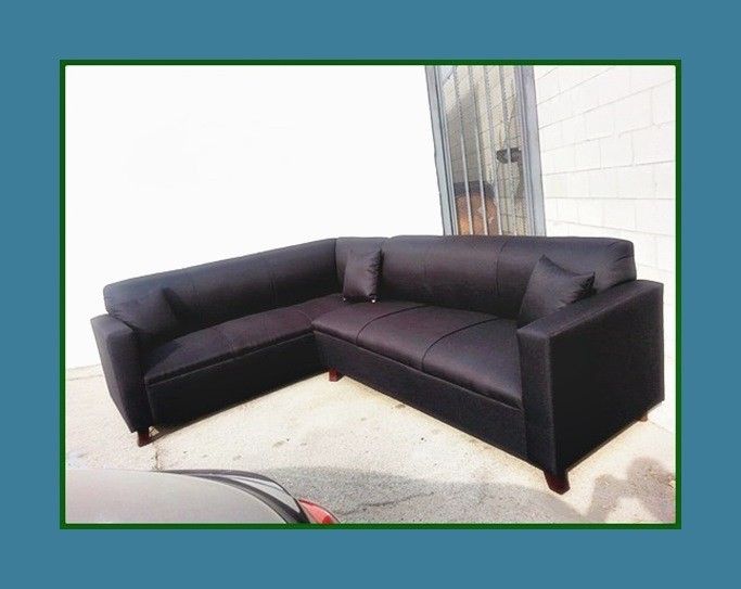 new 7x9 ft "Domino black" sectional couches