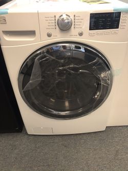 New scratch and dent kenmore front load washer. 1 year warranty