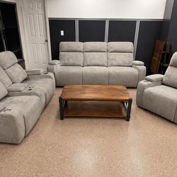 Three piece gray power reclining living room set