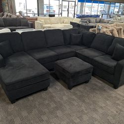 Large Comfy Black Sectional And Ottoman 