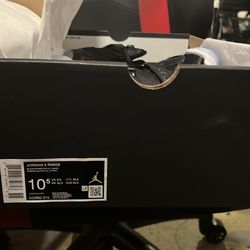 These are a pair of Jordan 6 Rings in the "Black/Gym Red" colorway, a hybrid sneaker celebrating Michael Jordan's six championship seasons.