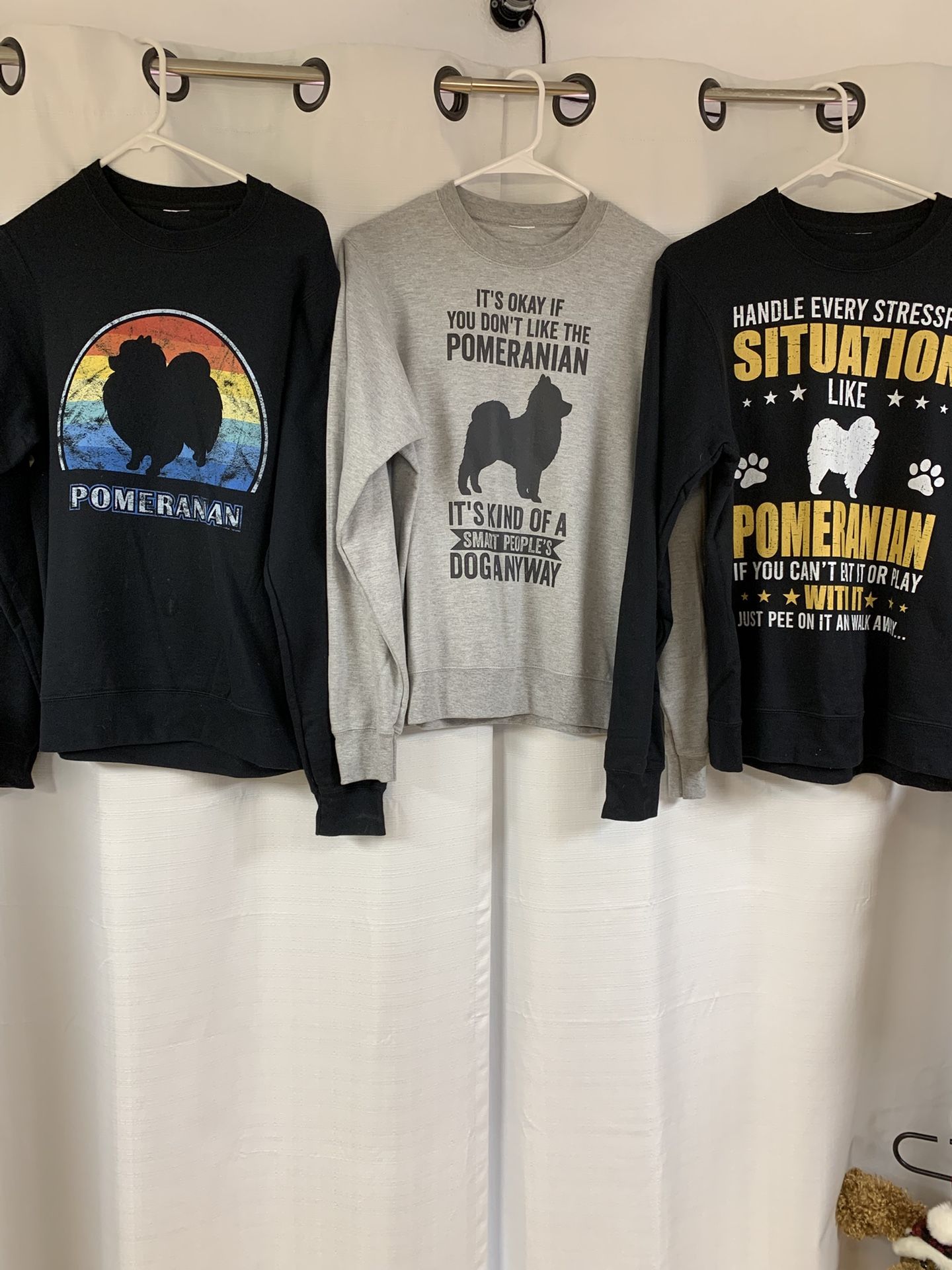 1 Black Pomeranian Rainbow Sweatshirt, 1 Black Pomeranian On Grey Sweatshirt, And 1 White Pomeranian On Black Sweatshirt.