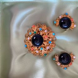 a vintage West Germany brooch and earrings set with faux pearls and glass stones. 