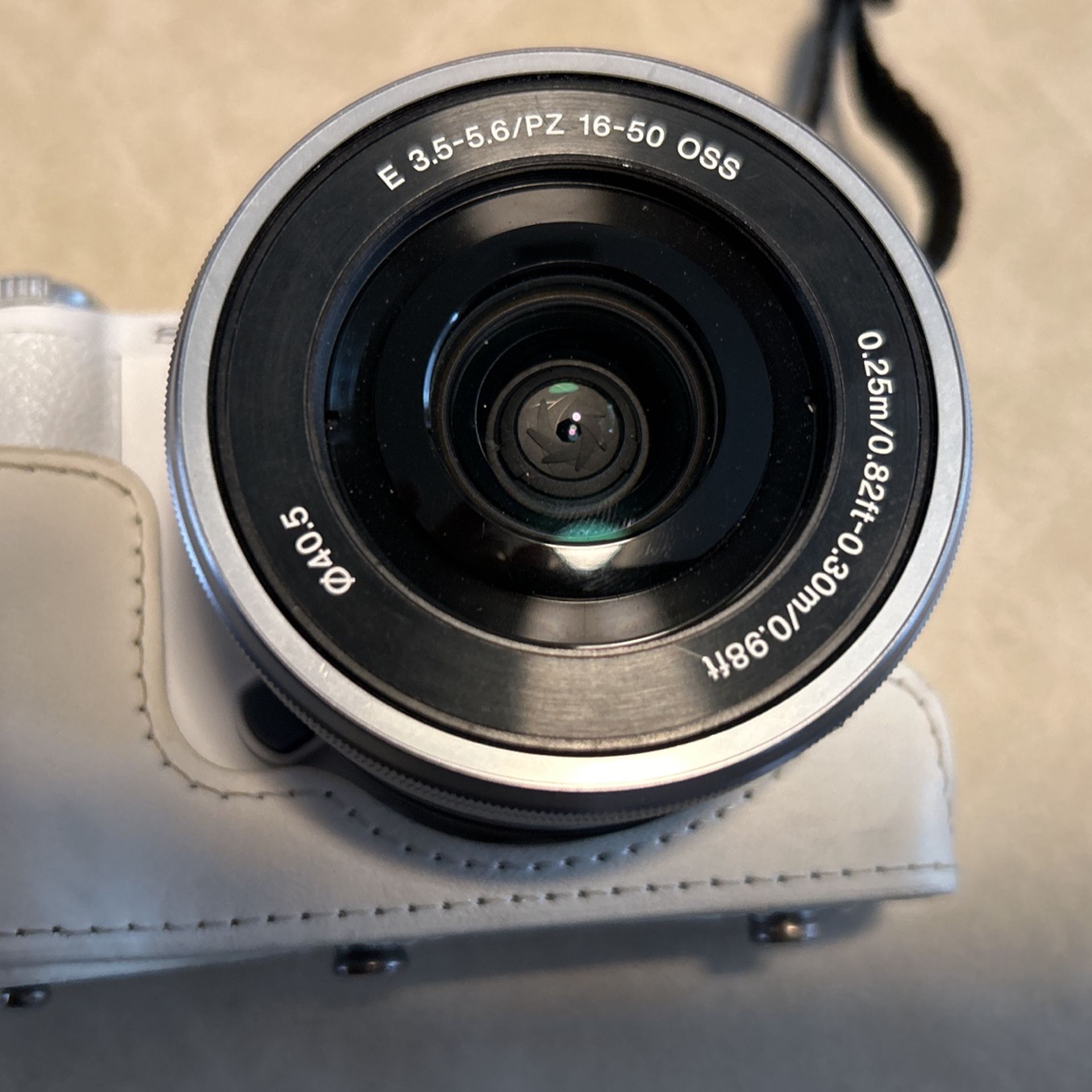 White Sony A5100 24.3MP with 16-50mm Lens and 3-inch flip up LCD