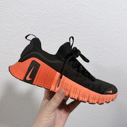 Nike black and Orange Metcon