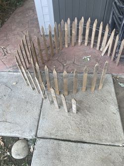Two Small Garden Wood Picket Fences