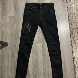 Amiri Wax Staggered Logo Skinny Jeans