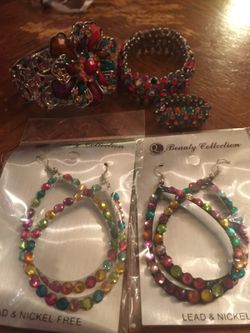 2 pairs of earrings one ring and 2 braclets