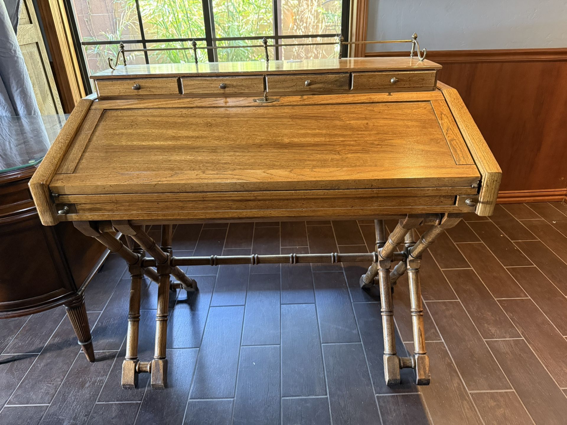 vintage campaign-style desk with faux bamboo legs.