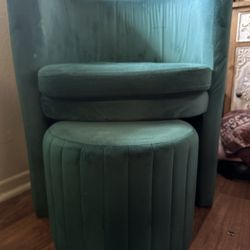Emerald green barrel chair with stool