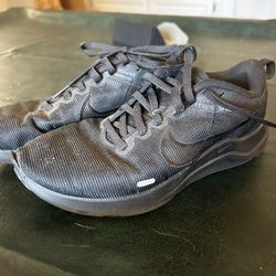 All black Nike shoes