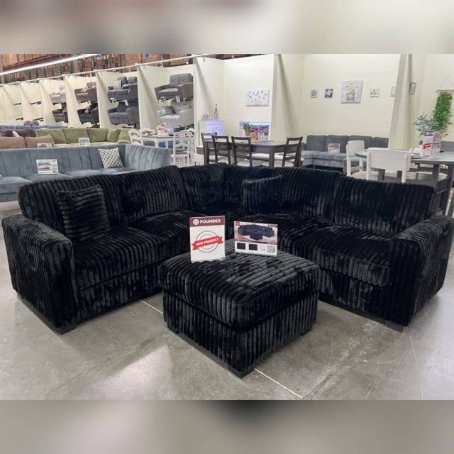 Black corduroy sectional sofa with ottoman