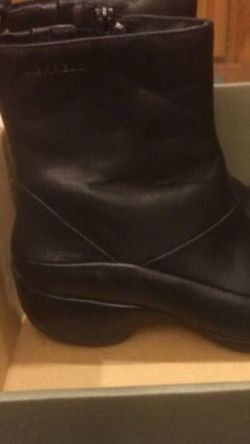 Merrill brand zip waterproof black boots. Never worn. Too narrow for me. Size 8.