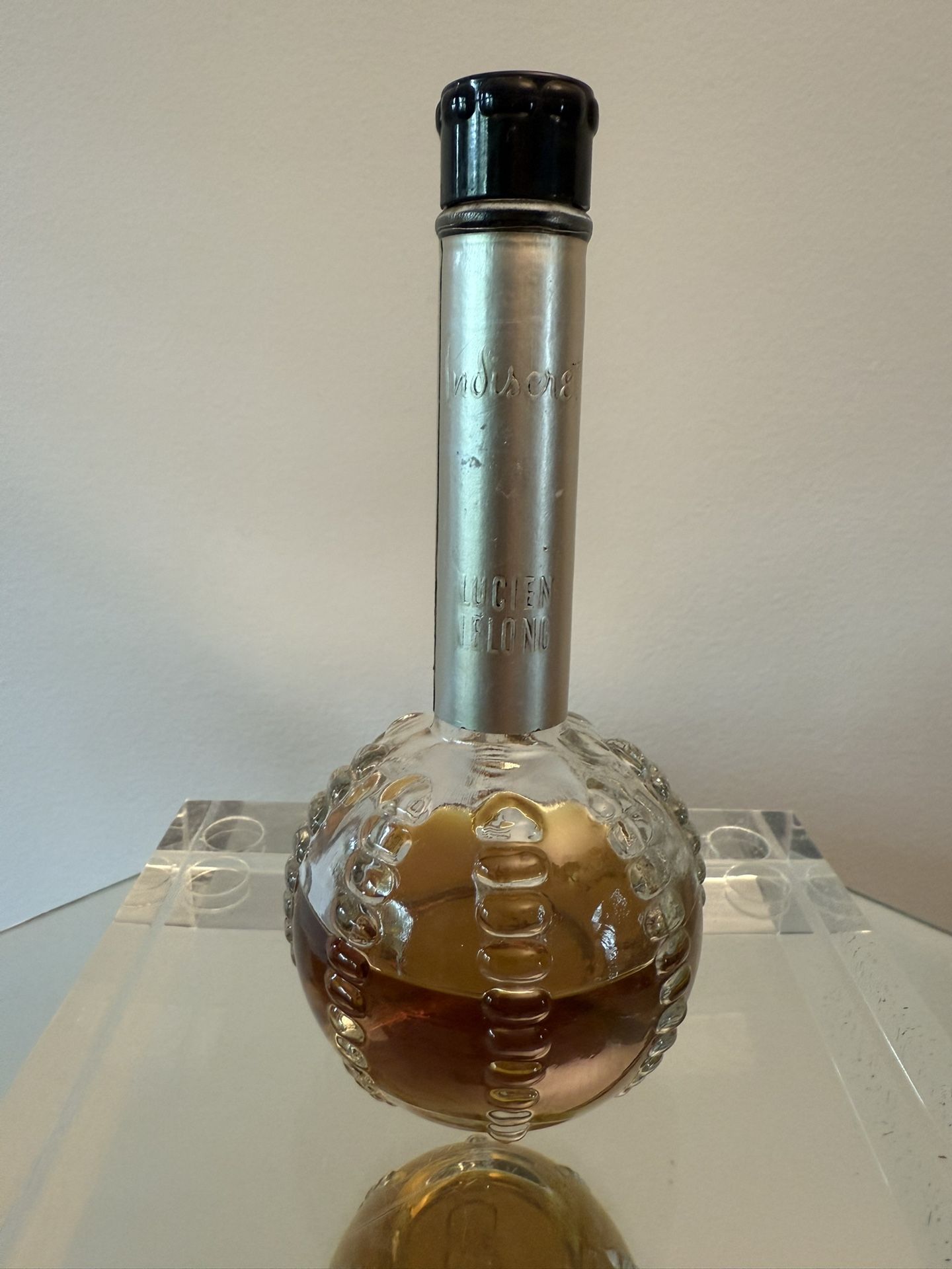 Vintage perfume Lucien Lelong Indiscrete Cologne bottle, retro, half full