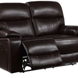 Leather power reclining loveseat with power headrest. Comes with a fabric cover
