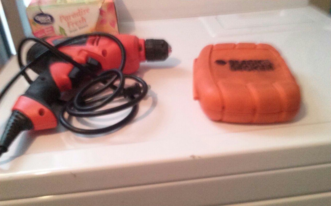 Black and decker drill with case of drill bits