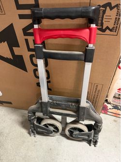 Compact folding hand truck w/retractable handles