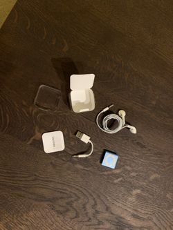 Apple iPod Shuffle-NEW (Never Used), includes original earbuds, charger, case and instruction booklet, 2GB