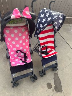 Two Umbrella Strollers – Minnie Mouse & American Flag $15 for one, or $25 for both.