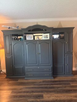 Solid wood armoire cabinet 9ft wide 6ft tall 25 in deep middle ,ends 17 inches deep