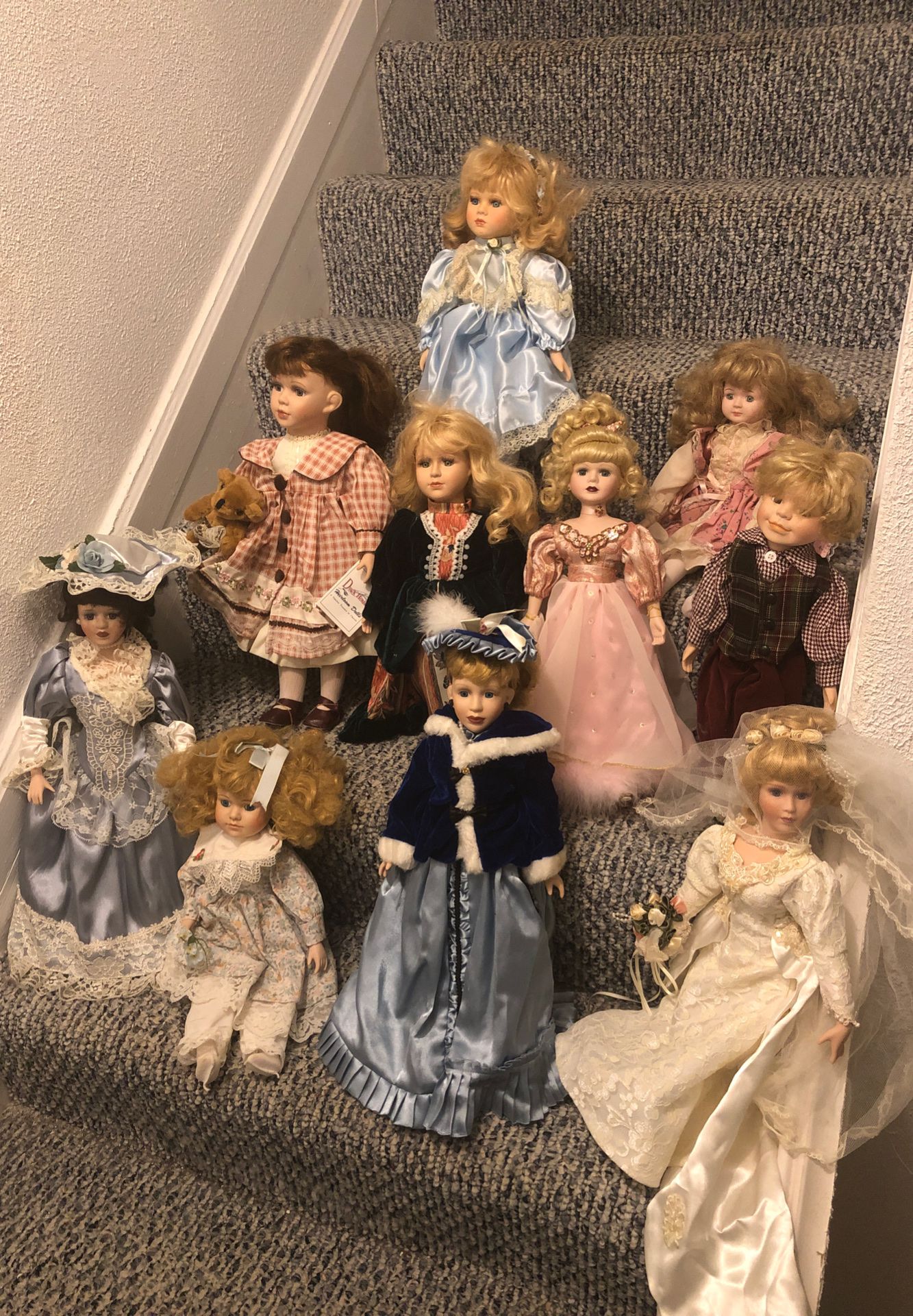 Collection of heirloom porcelain dolls never played with excellent condition stored for years in an air tight bin