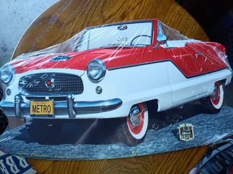 Nash Metro shaped metal sign