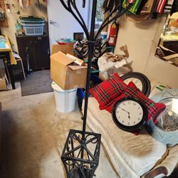 Black cast iron coat rack umbrella stand combo.
Very heavy
69"h x 12.5" w 