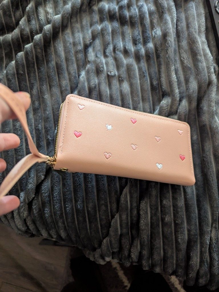 Brand new pink wallet with hearts and wristlet.