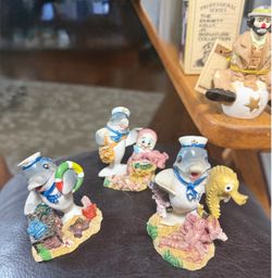 3 small ceramic dolphins cute