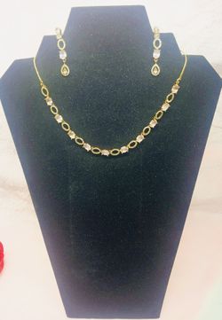 This gold-plated American diamond necklace and earrings set