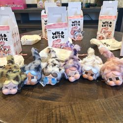 Pop Mart Crybaby Wild but Cutie Series Vanilla Cutie, Denim Cutie, Camo Cutie, Pink Cutie, Neon Cutie, & Vintage Cutie.