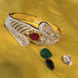 Beautiful gold plated bracelet with three extra stones, you can adjust according to your dress.