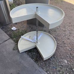 Rev-A-Shelf polymer pie-cut lazy susan organizer designed for corner base cabinets. 