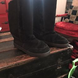 Knee-high black suede boots
