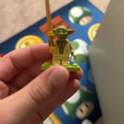 Yoda With A Golden Light Saber