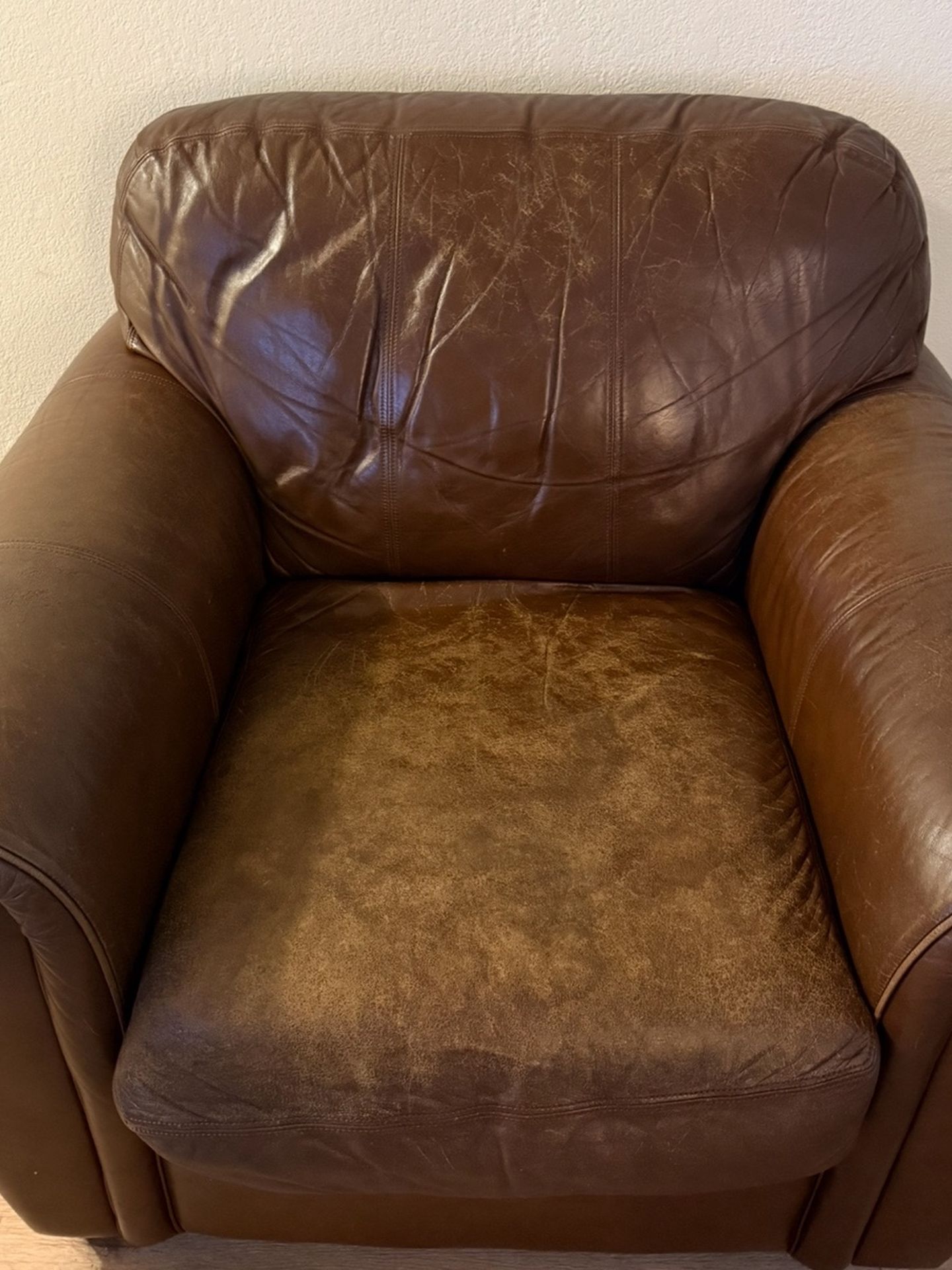 Genuine leather armchair and ottoman