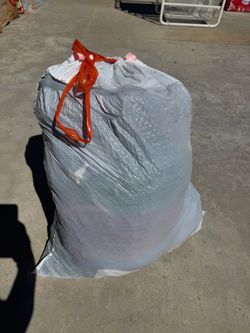 Variety of women’s clothes - full bag