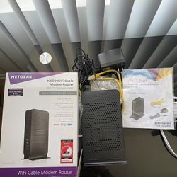 Netgear Dual-Band Gigabit WiFi Cable Modem & Router (C(contact info removed)NAS)
