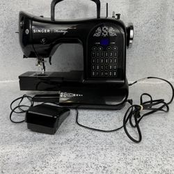 Singer Heritage 8768 computerized electronic sewing machine in black.